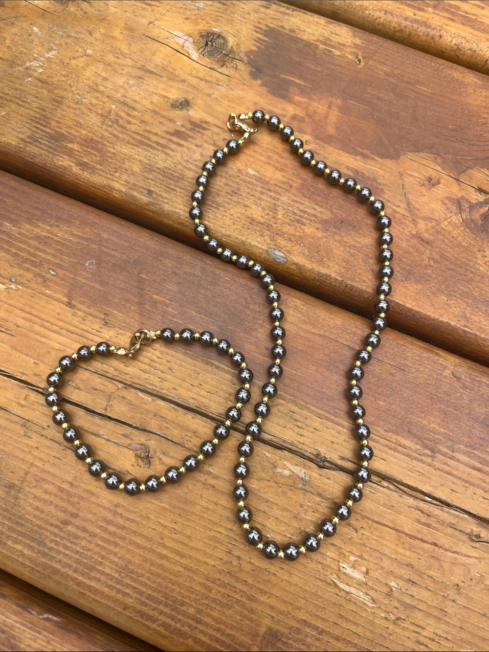 Black and gold beaded jewelry necklace and bracelet set
